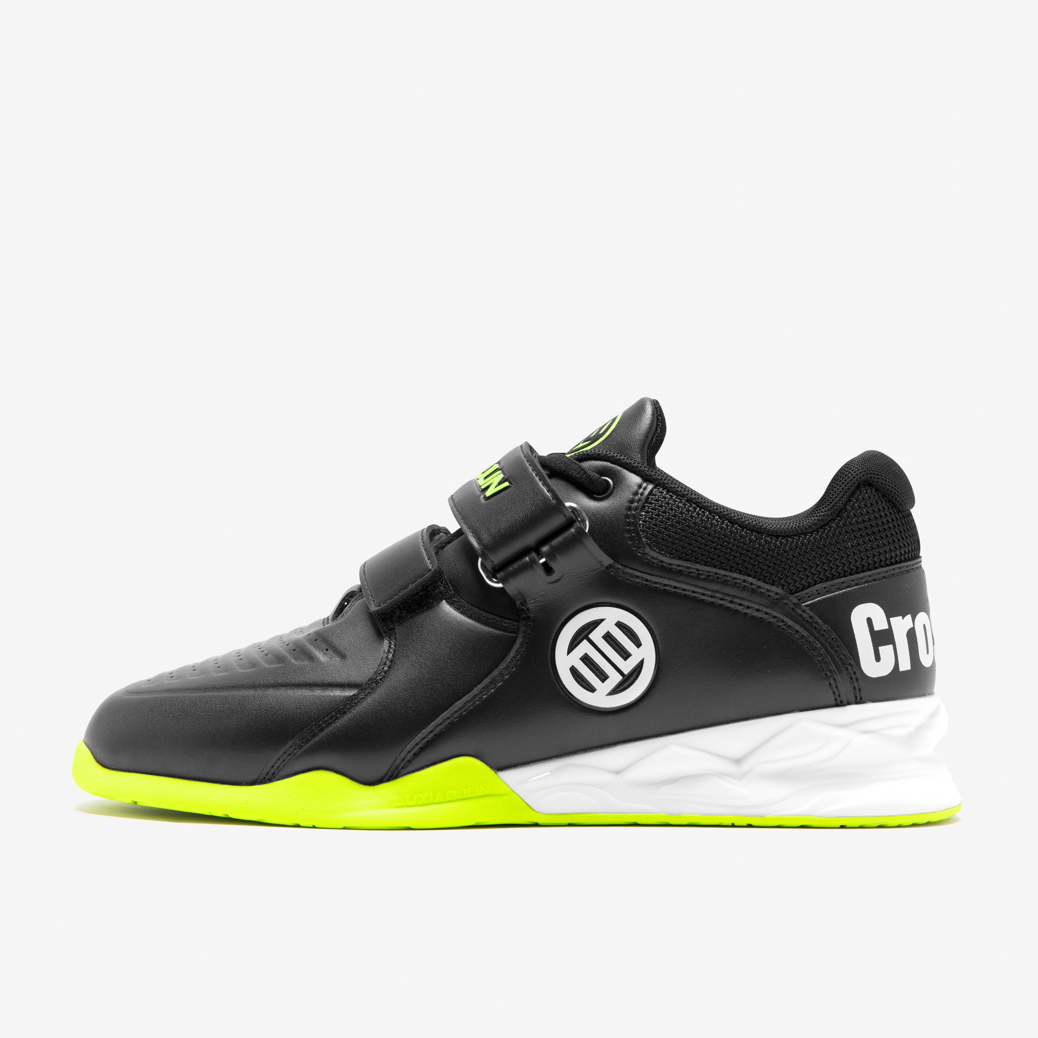 Black and green athletic shoe with a visible brand logo on a white background