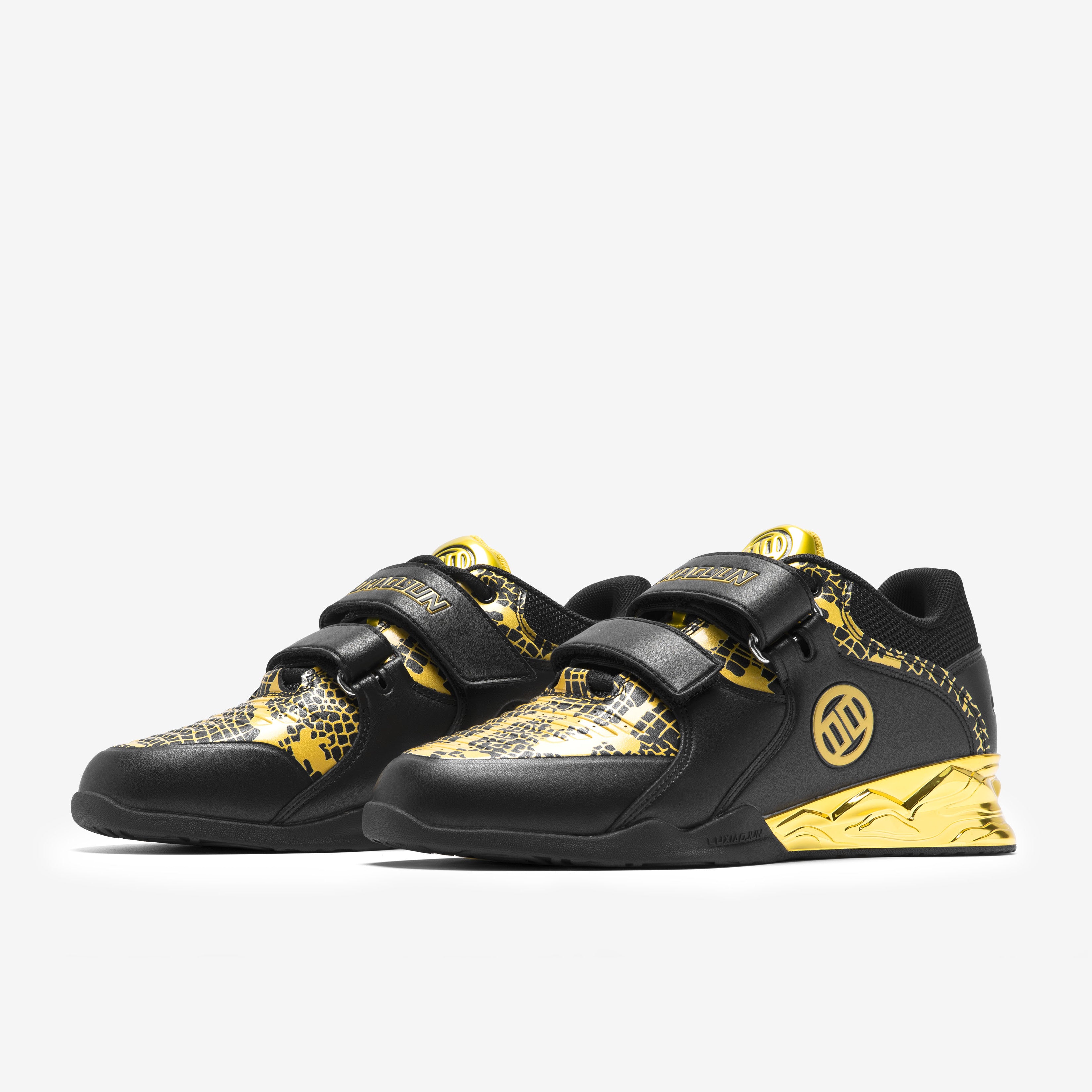 A pair of LUXIAOJUN PowerPro Weightlifting Shoes in a limited snake edition featuring black and gold colors with snake patterns and a velcro strap.