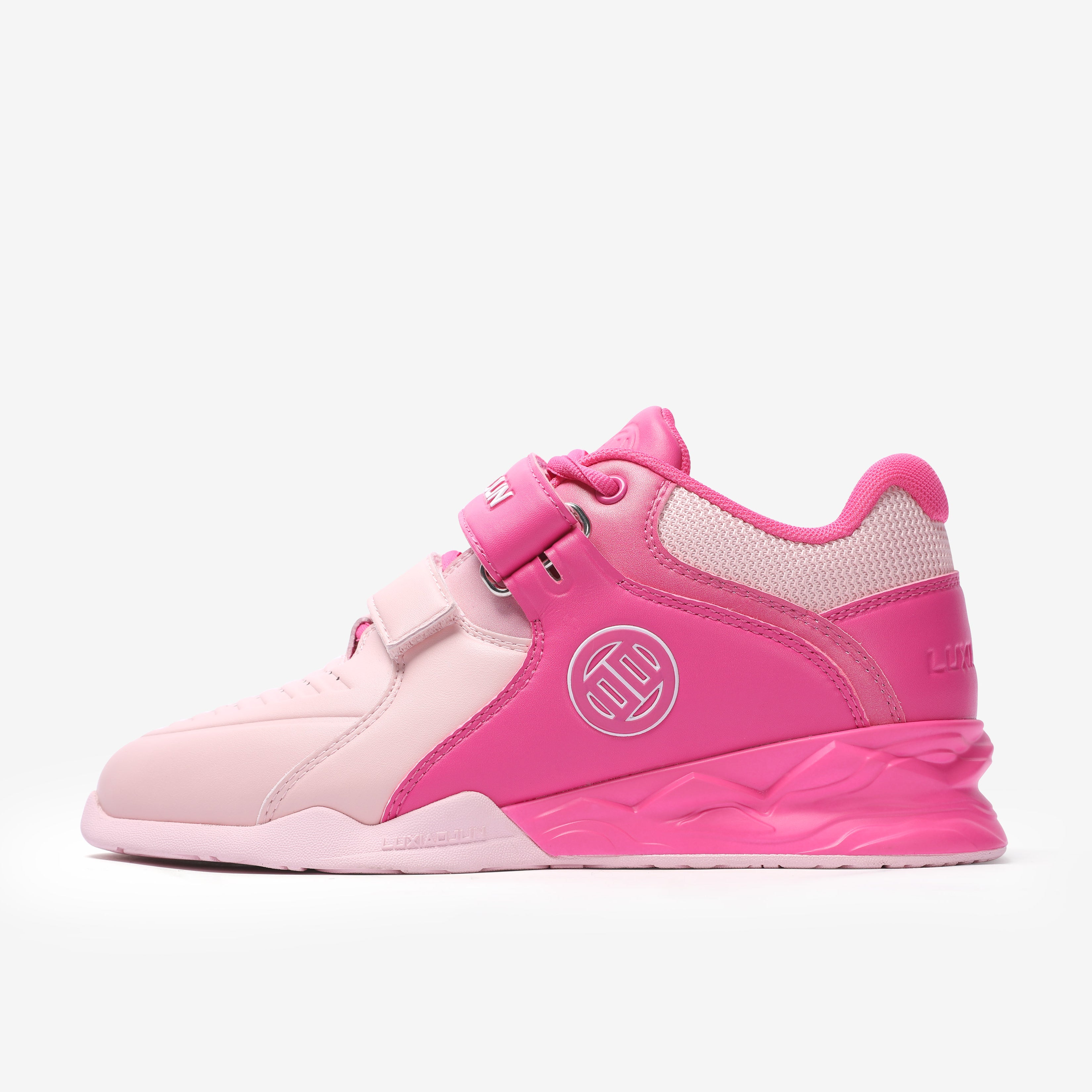 A pair of pink weightlifting shoes with white details and a logo on the side.