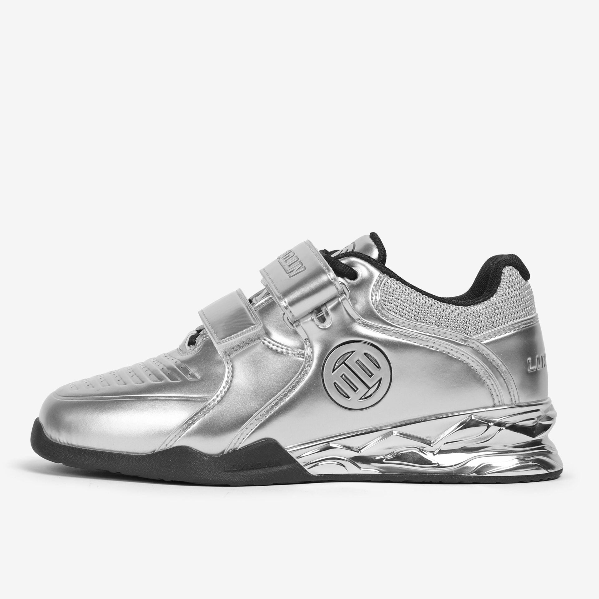 A silver weightlifting shoe designed for stability and support during weight training, featuring a distinctive brand logo on the side.