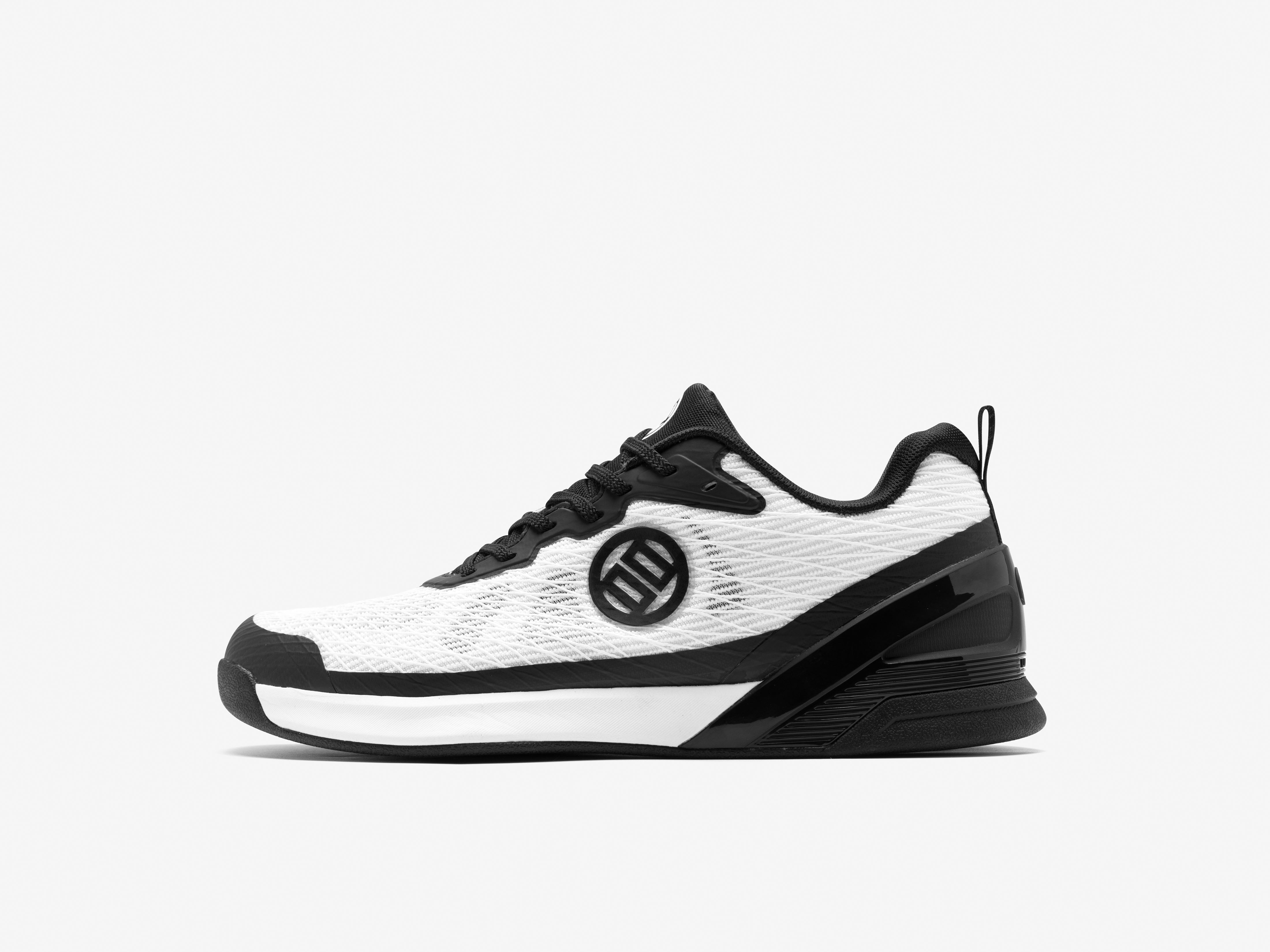 Black and white sneaker with a brand logo on a light gray background