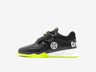 Black and green athletic shoe with a visible brand logo on a white background