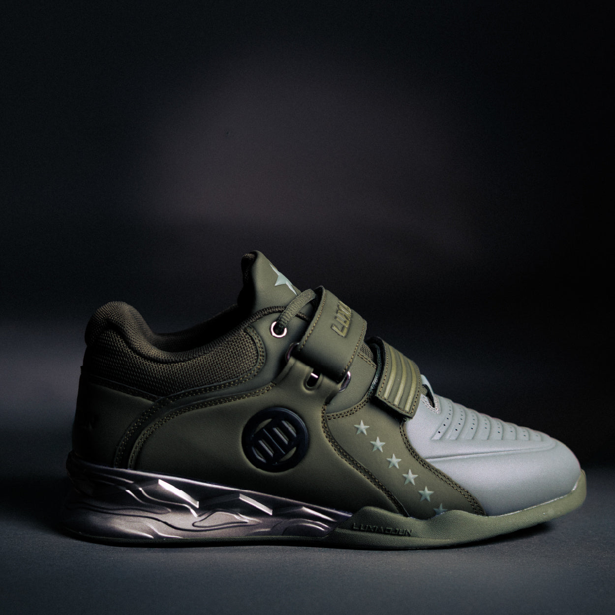 Green and gray sneaker with a dark background
