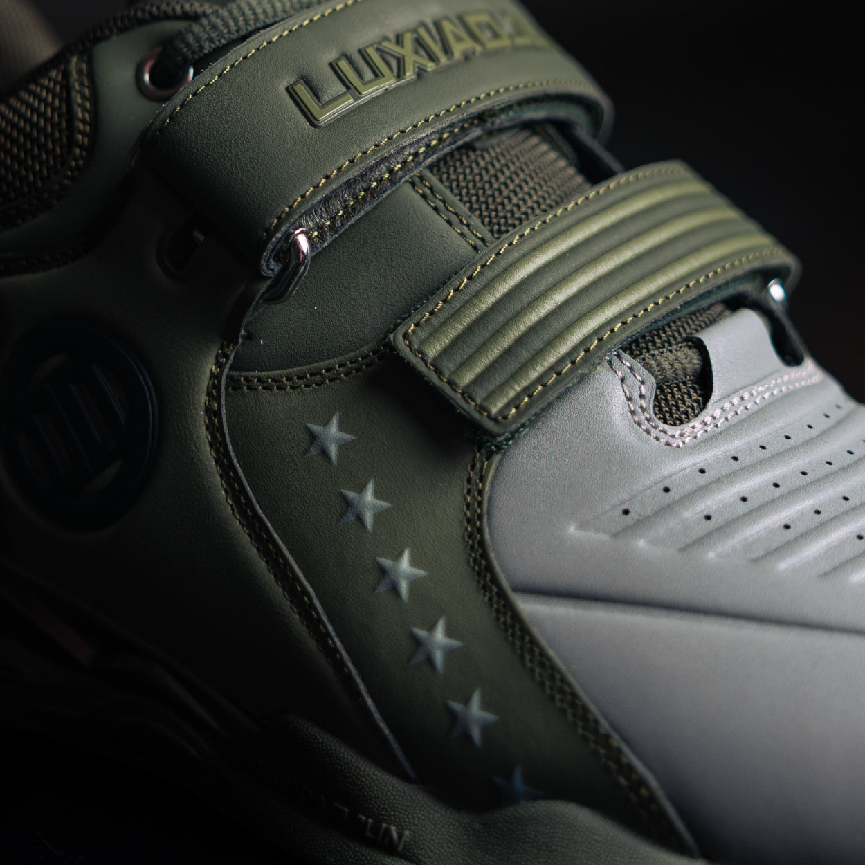 Close-up of a green and white shoe with 'Luxxade' branding on a dark background