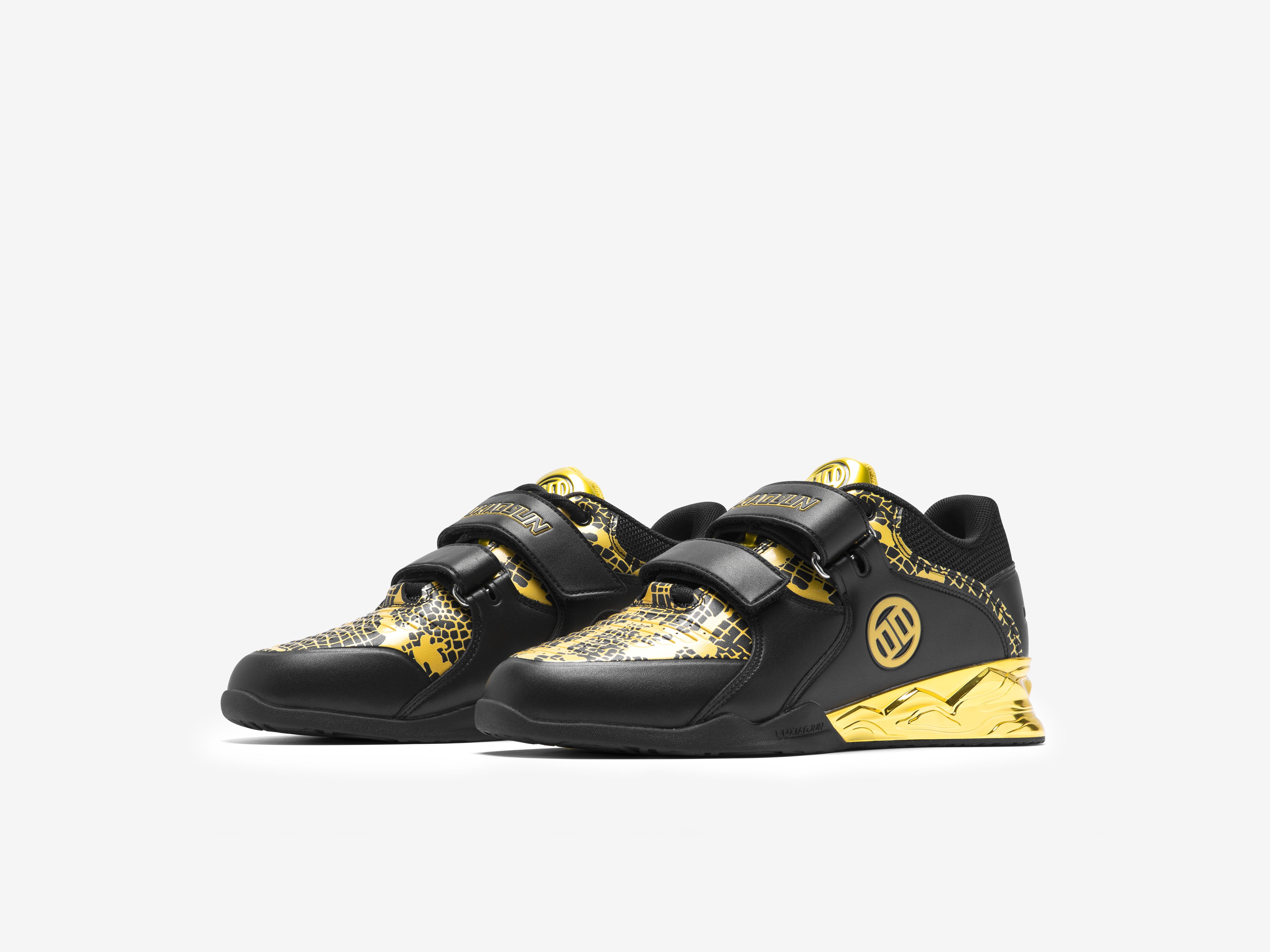 A pair of LUXIAOJUN PowerPro Weightlifting Shoes in a limited snake edition featuring black and gold colors with snake patterns and a velcro strap.