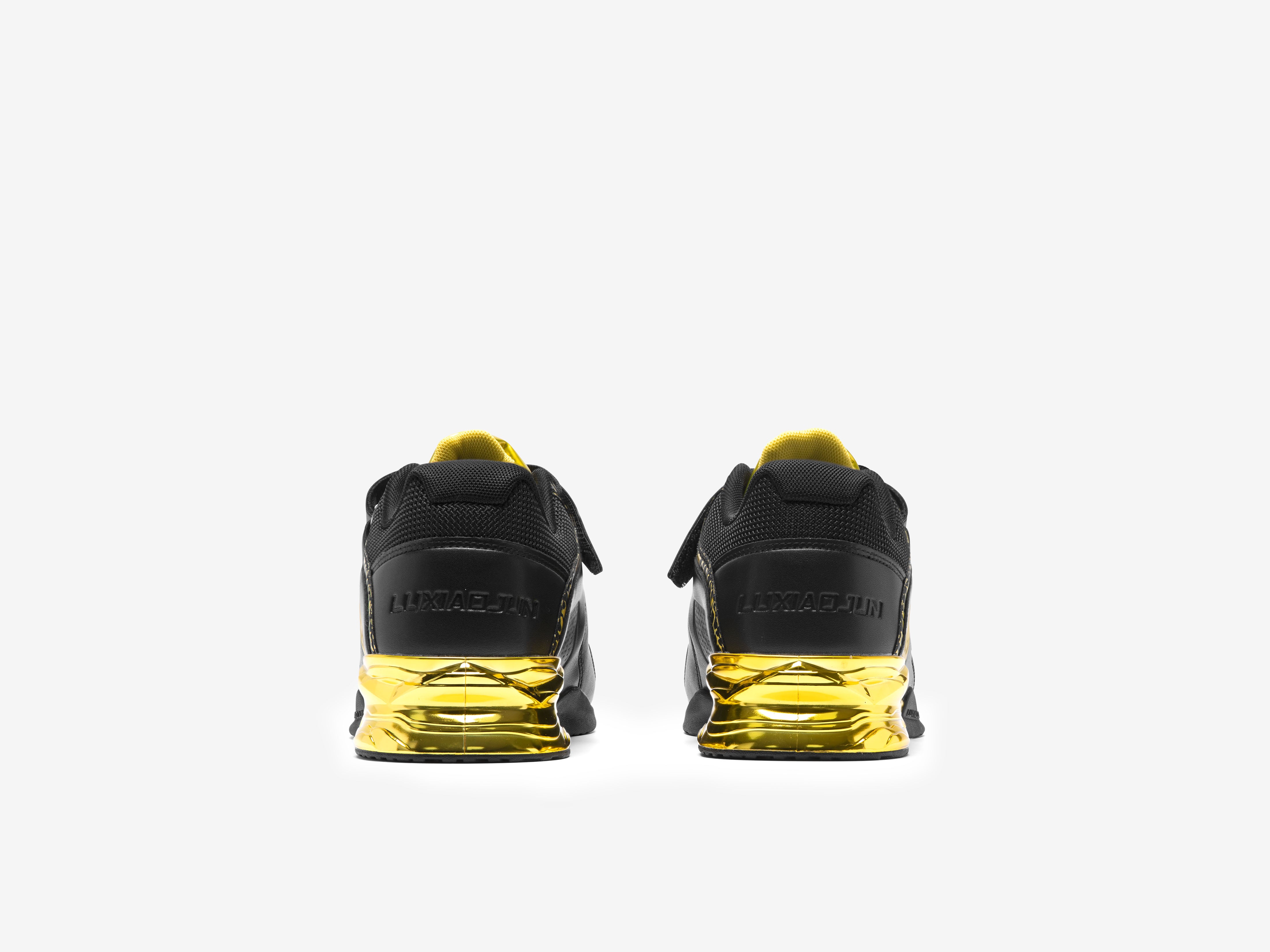The back view of the black and gold limited edition weightlifting shoes on a white background