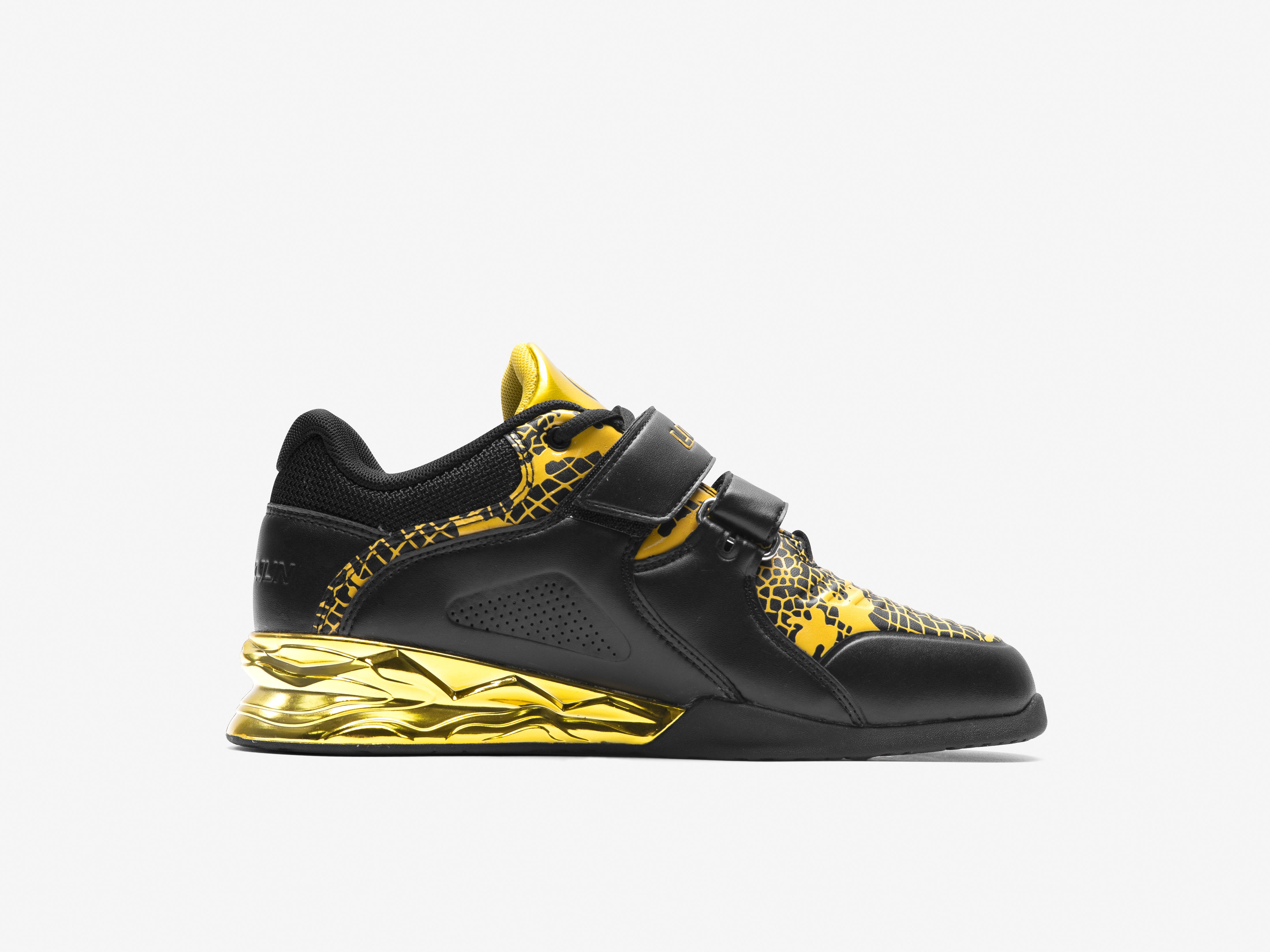 The inner side of the black and gold weightlifting shoes limited edition on a white background