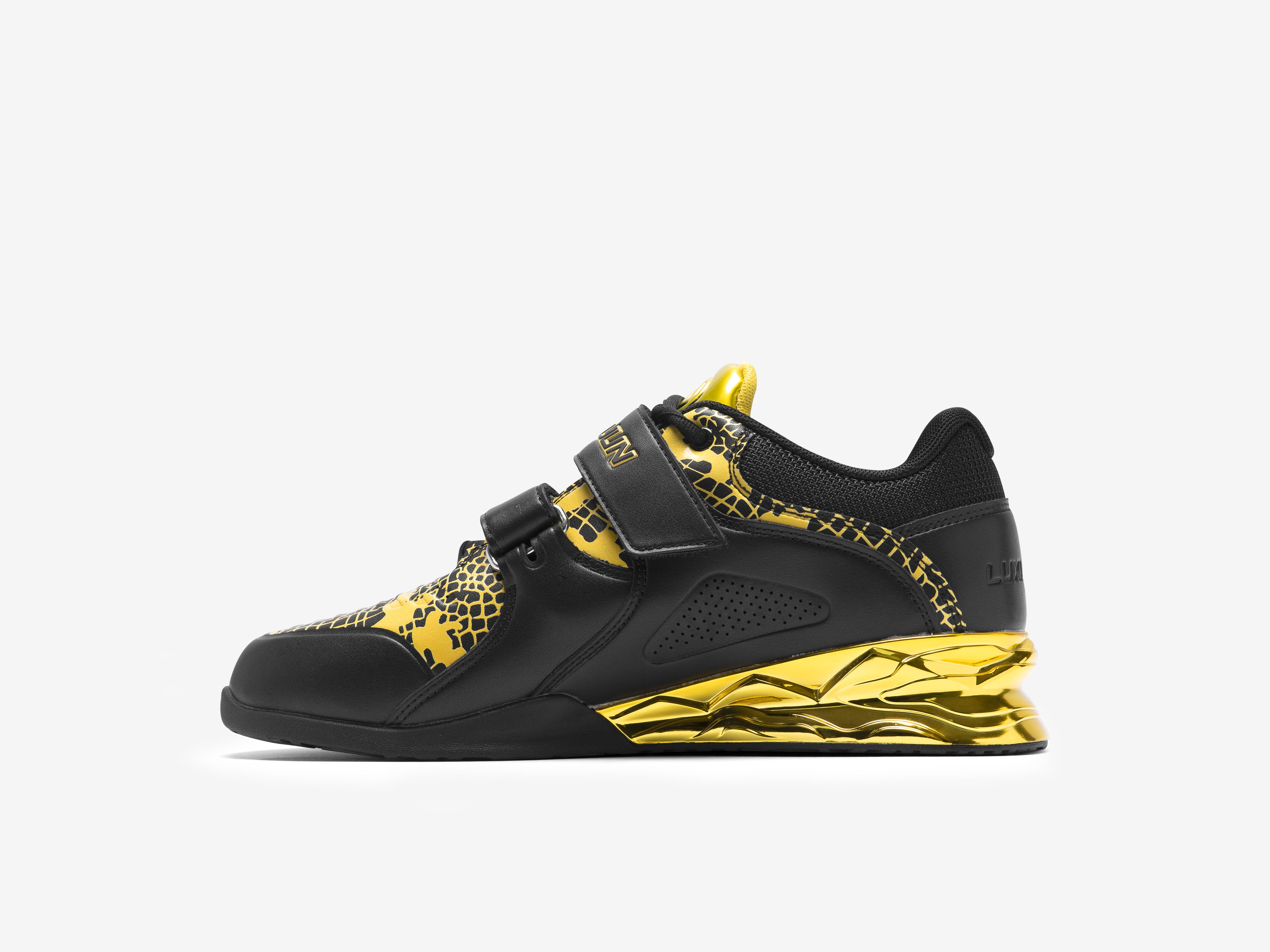 The inner side of the right side of the black and gold limited edition weightlifting shoes on a white background