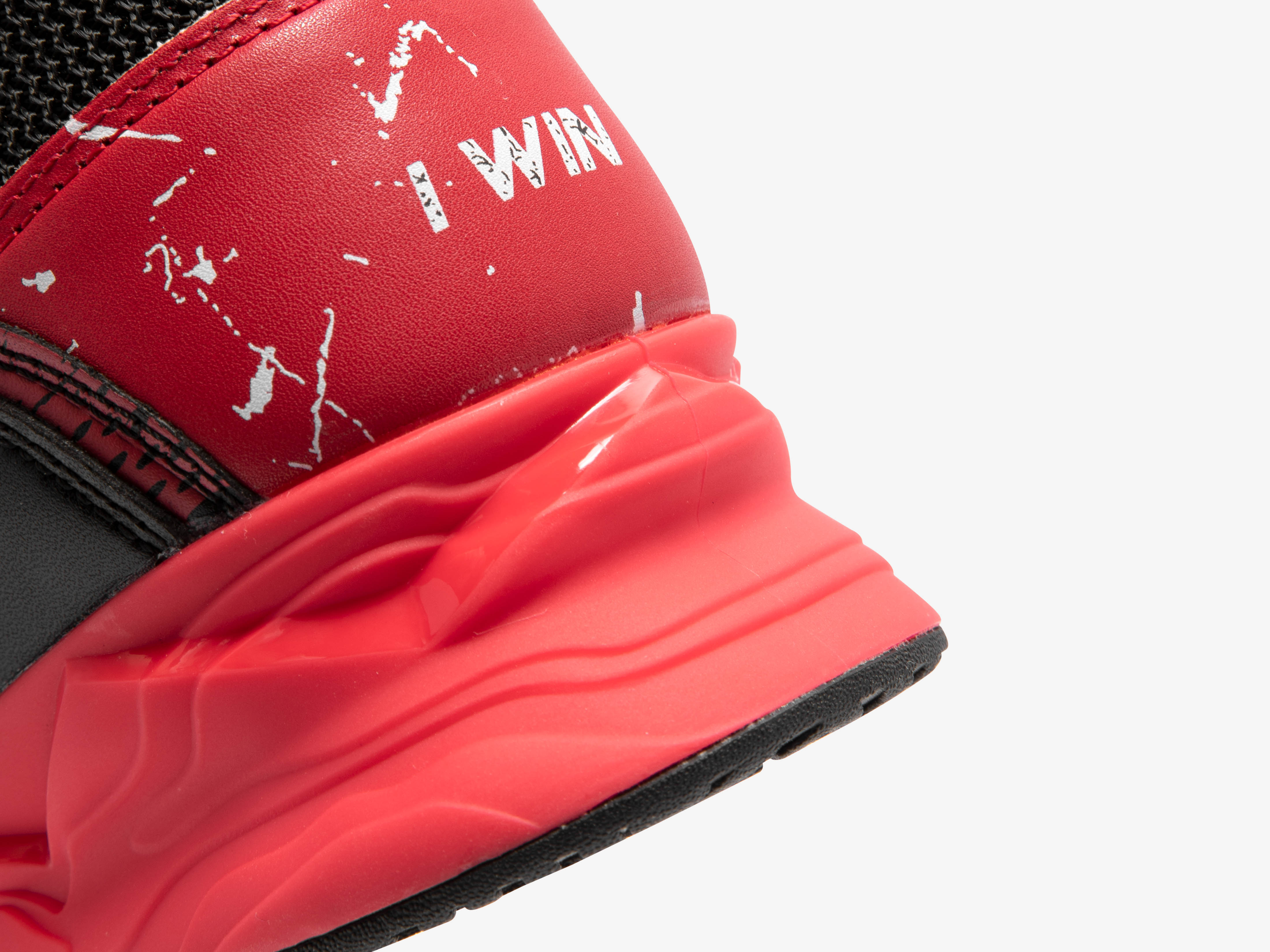 Close-up of a black and red Karlos Edition weightlifting shoes with black accents on a white background