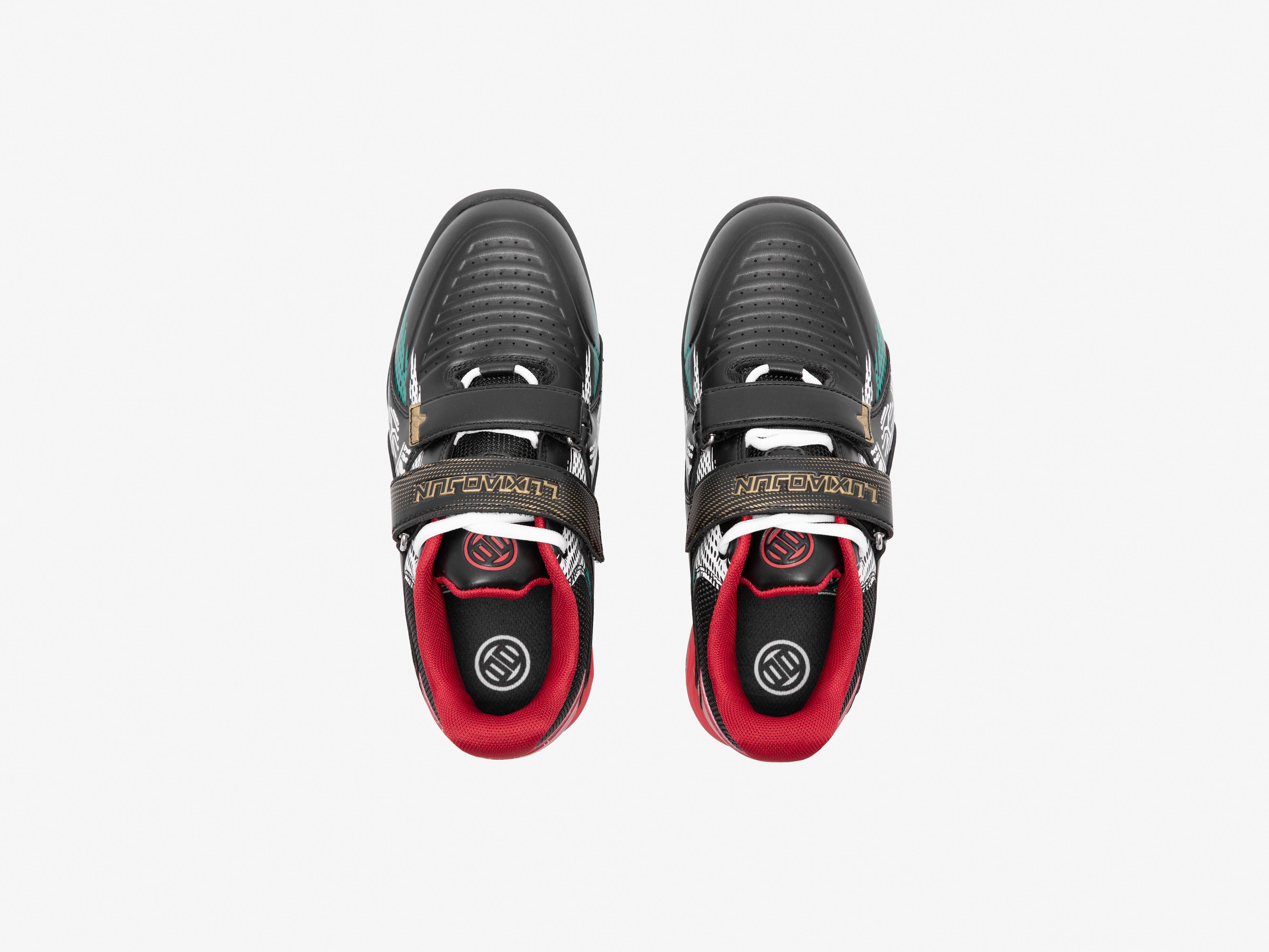 Pair of black and red Karlos Edition weightlifting shoes on a white background