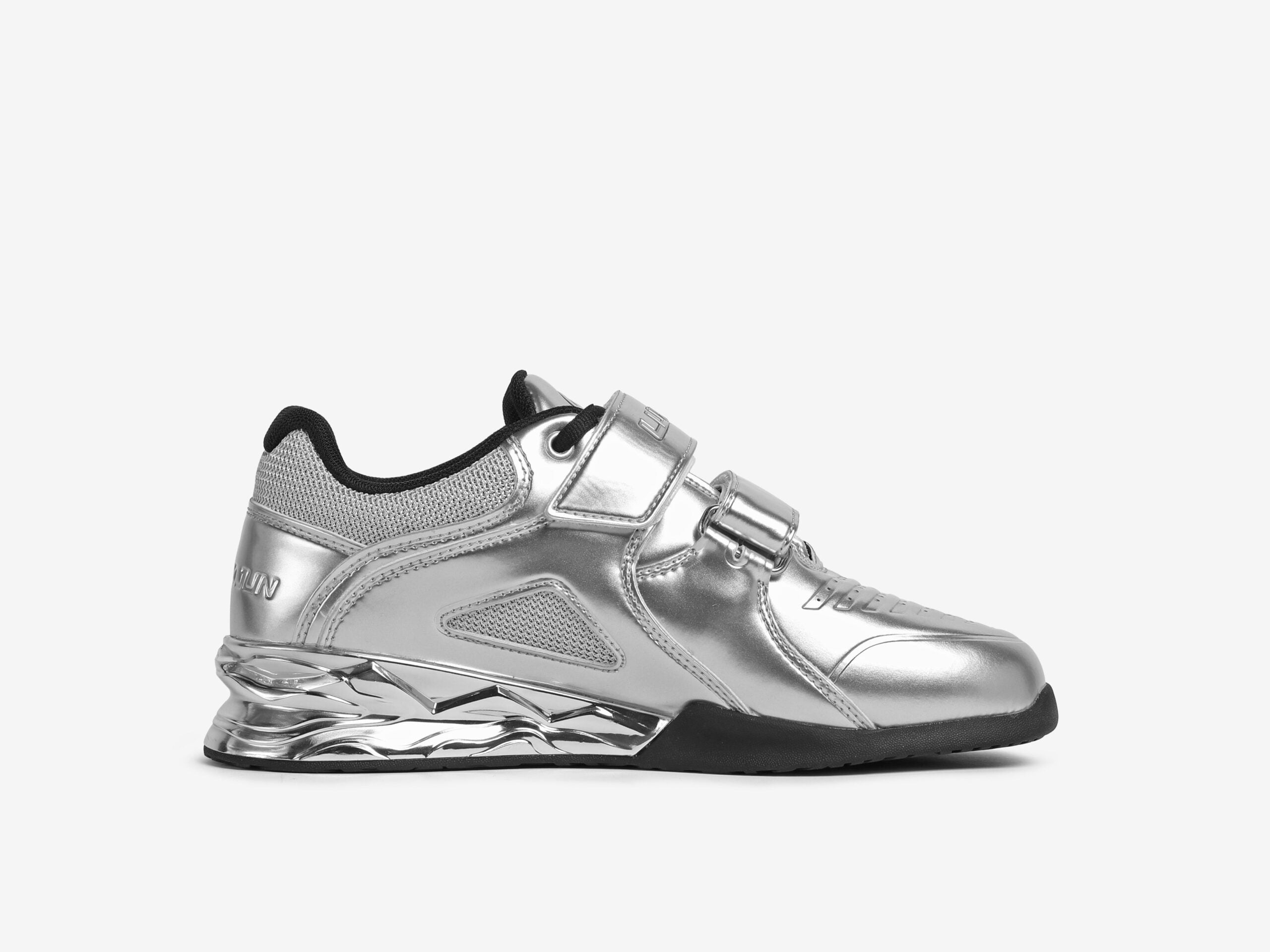 The inner side view of the silver weightlifting shoes on a white background