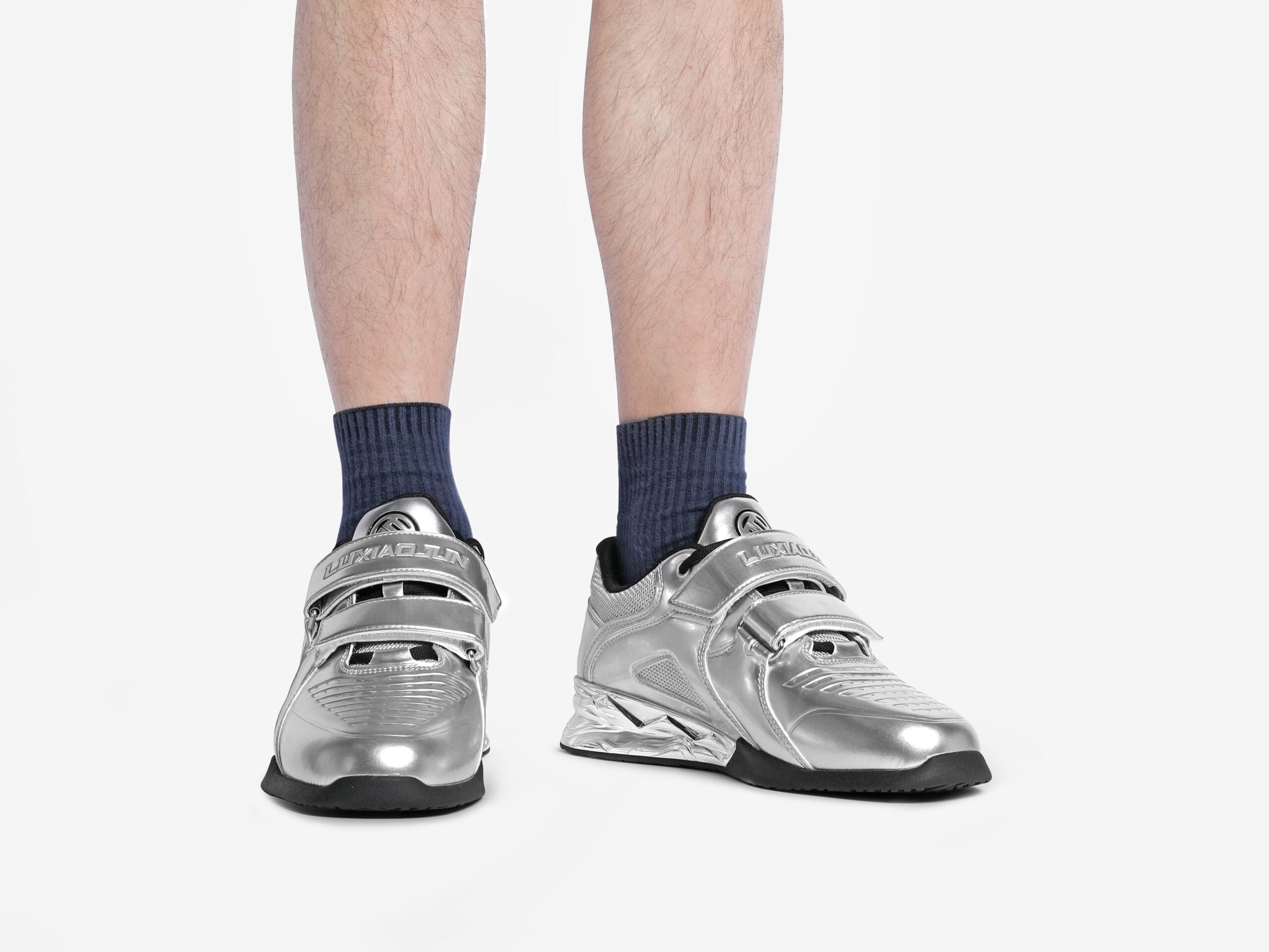 The front view of the silver stable luxiaojun weightlifting shoes on a person's legs 