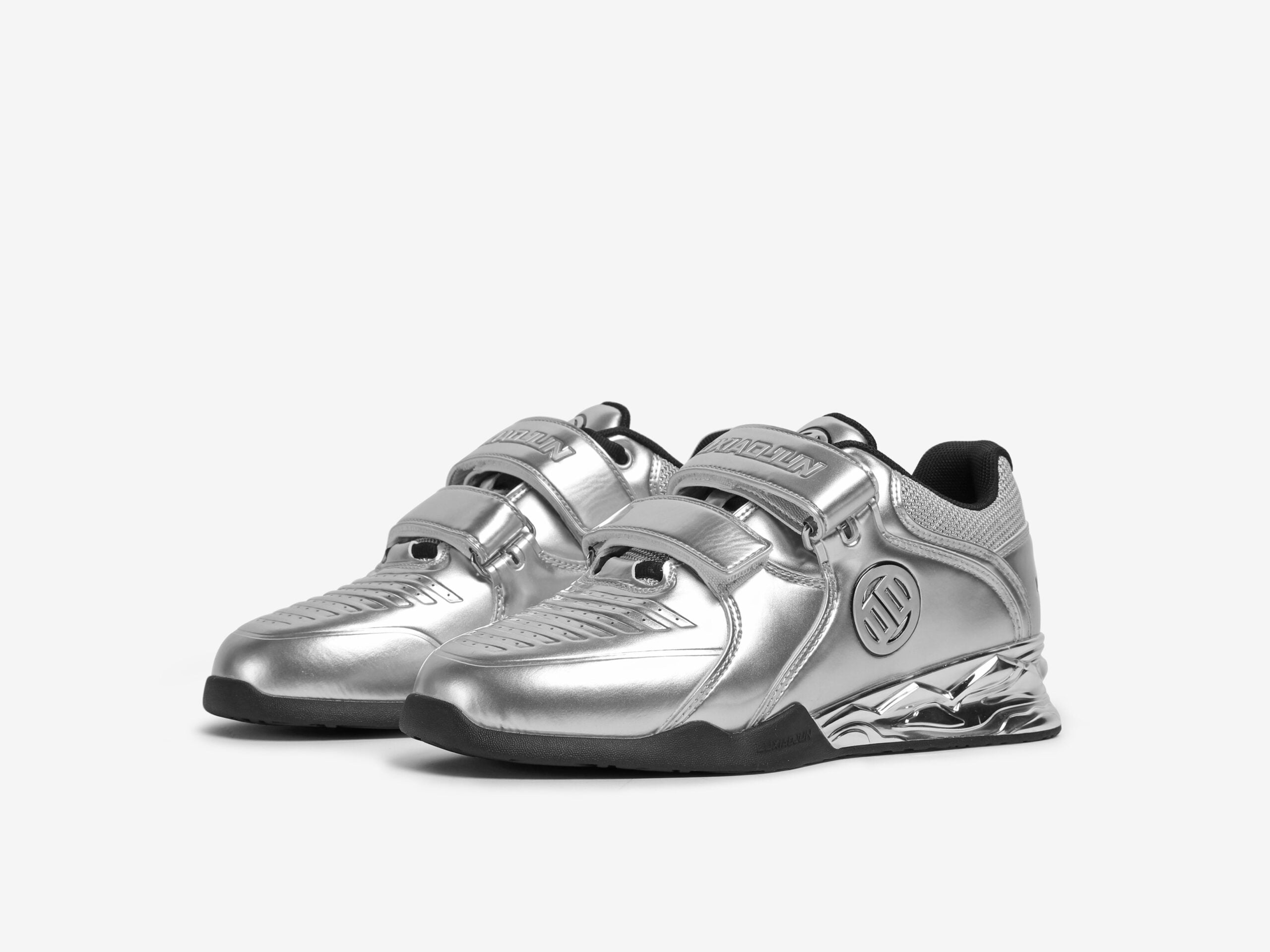 The front view of a pair of silver weightlifting shoes by luxiaojun on a white background