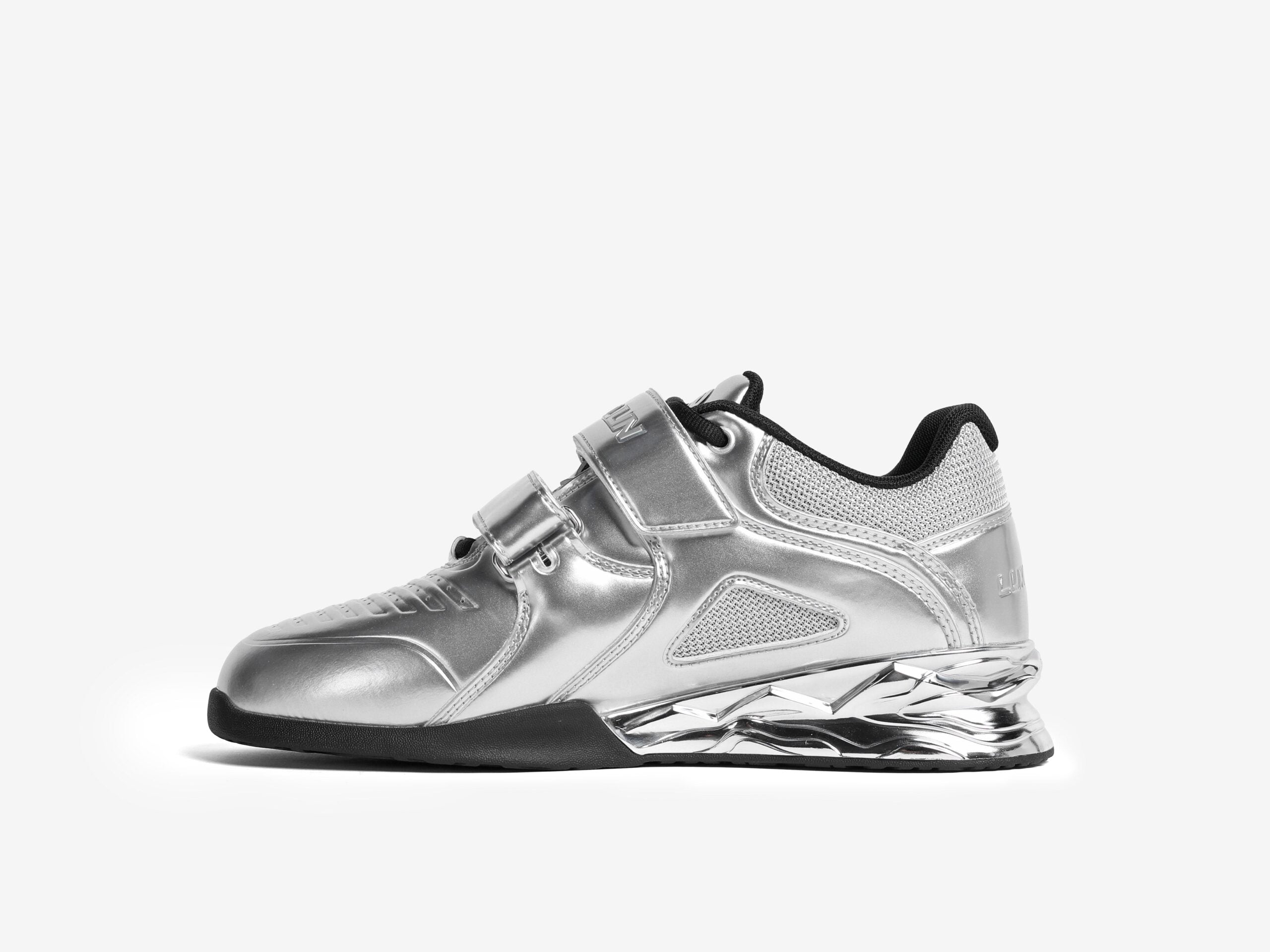 The inner side of the right side shoe of the silver luxiaojun weightlifting shoes on a white background