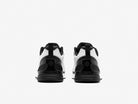 Black and white athletic shoes on a light gray background