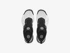 Pair of black and white sneakers on a light gray background