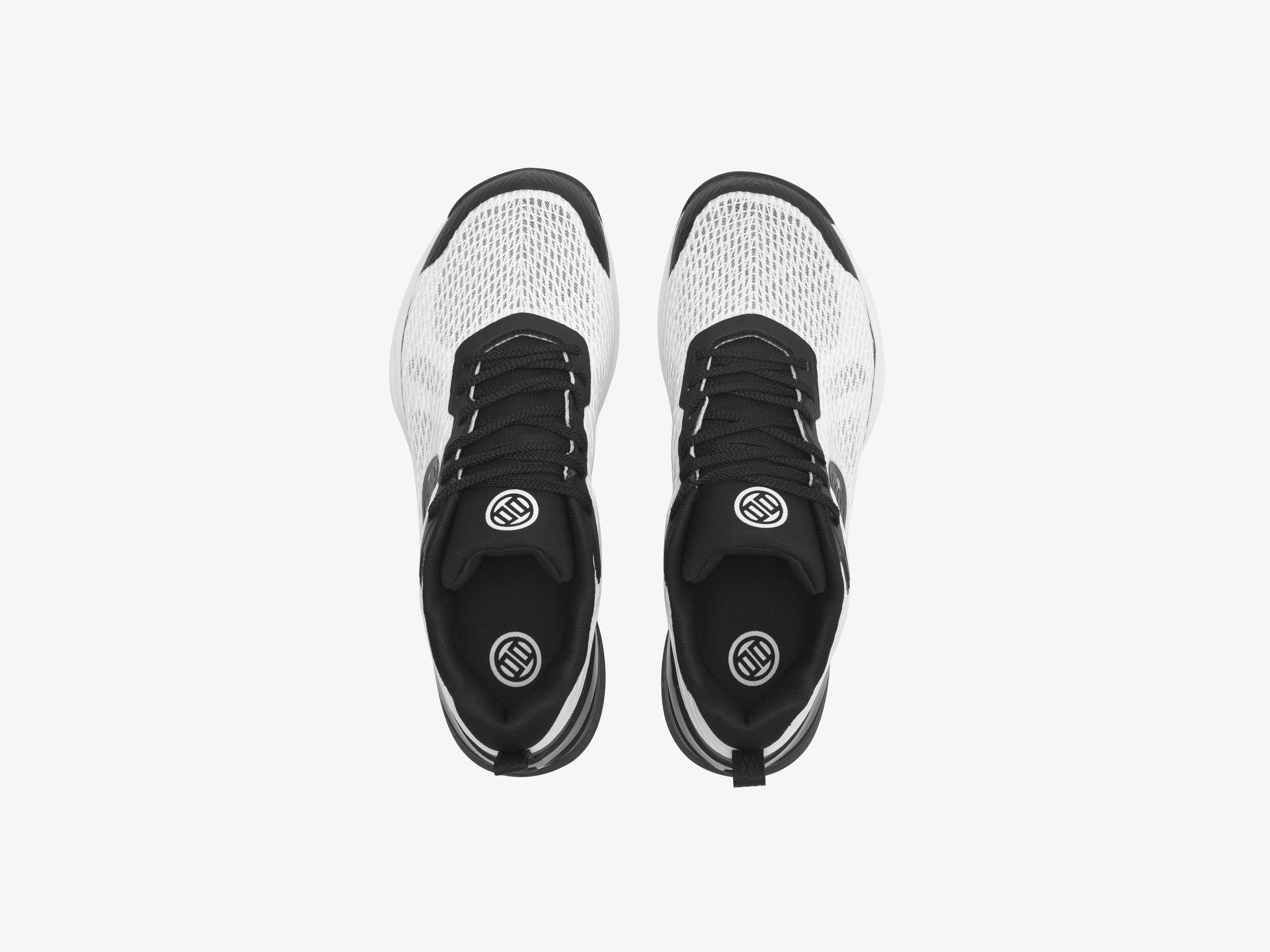Pair of black and white sneakers on a light gray background