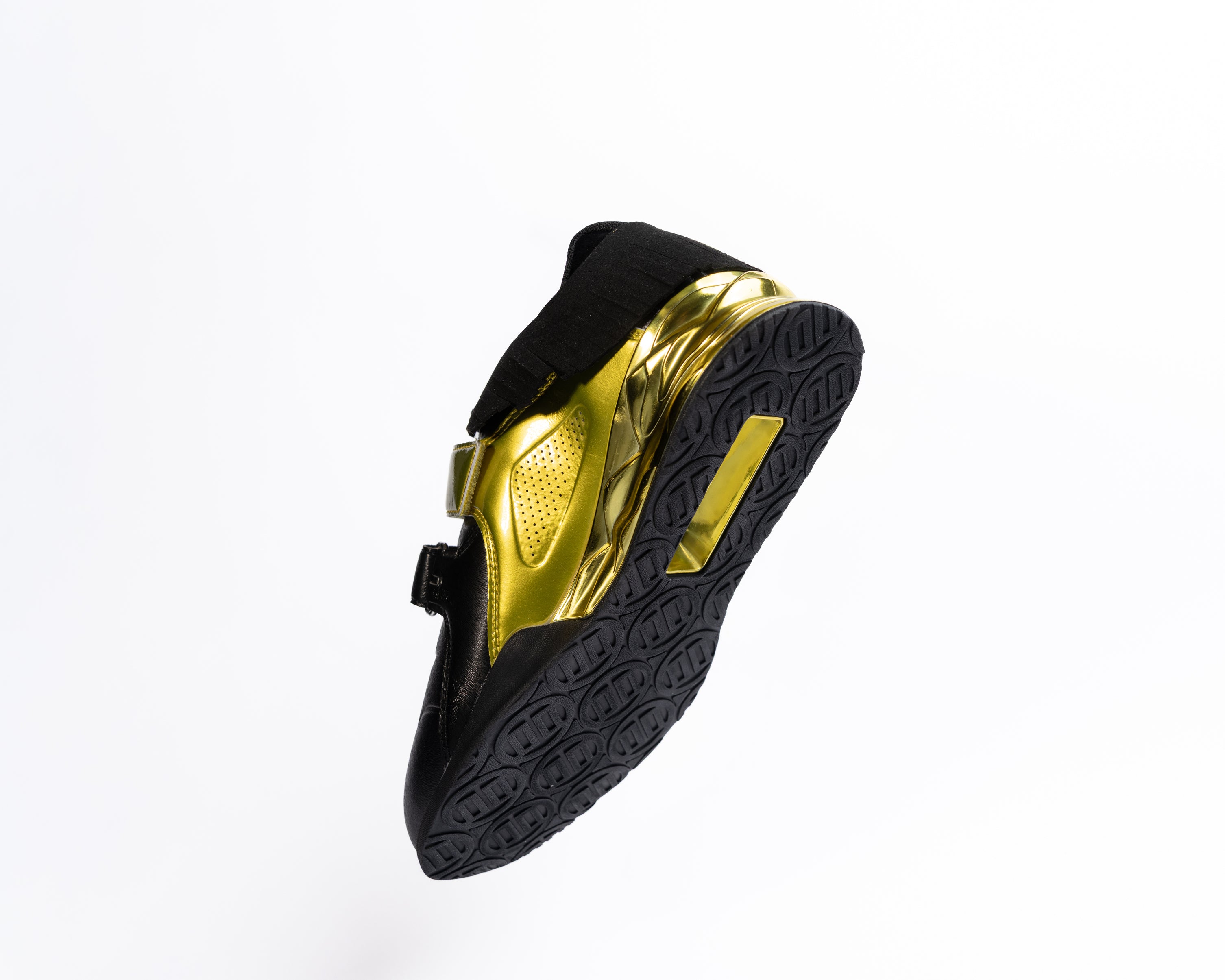 Black and gold lifting shoe on a white background
