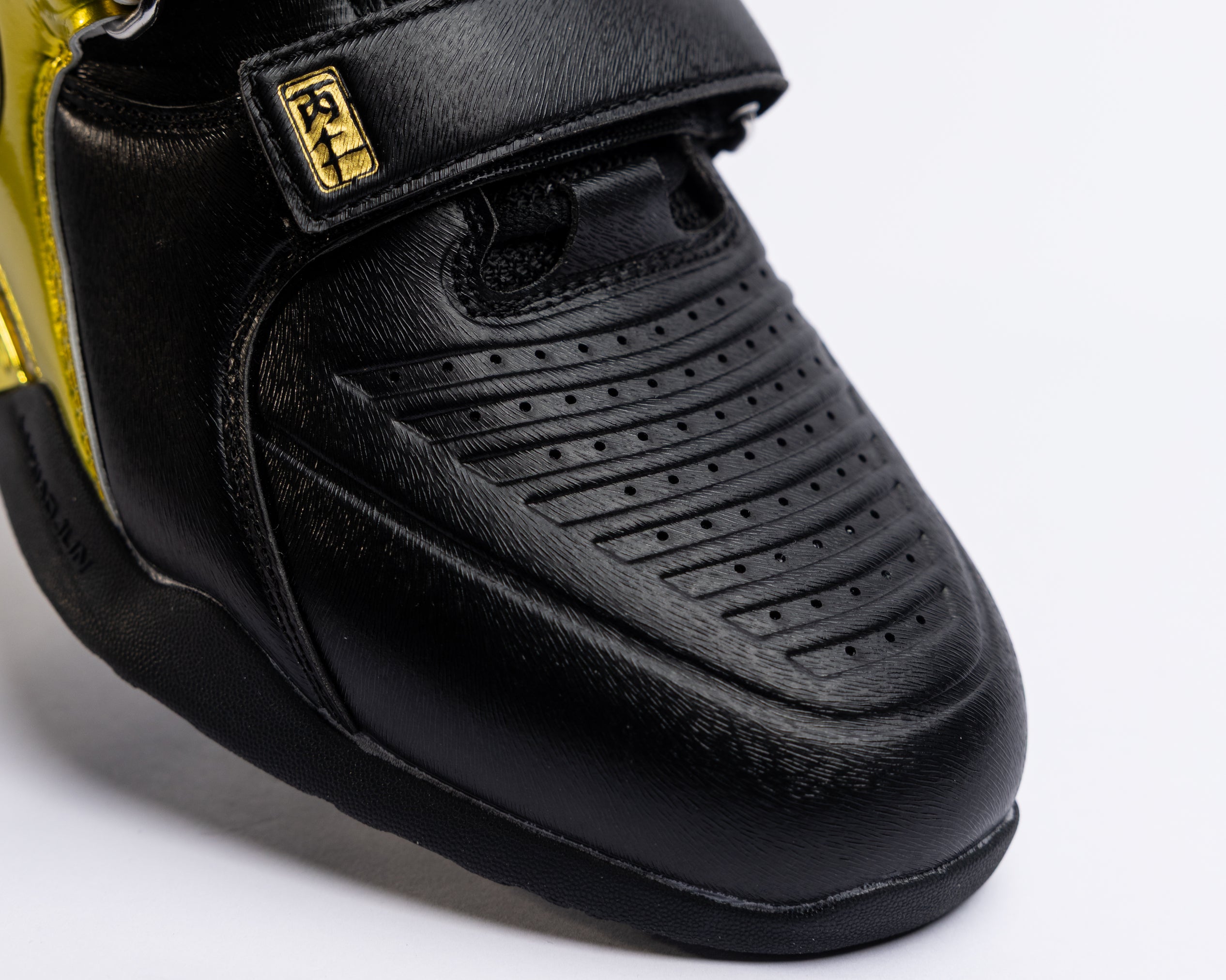 Black lifting shoes with a brand logo on a white background