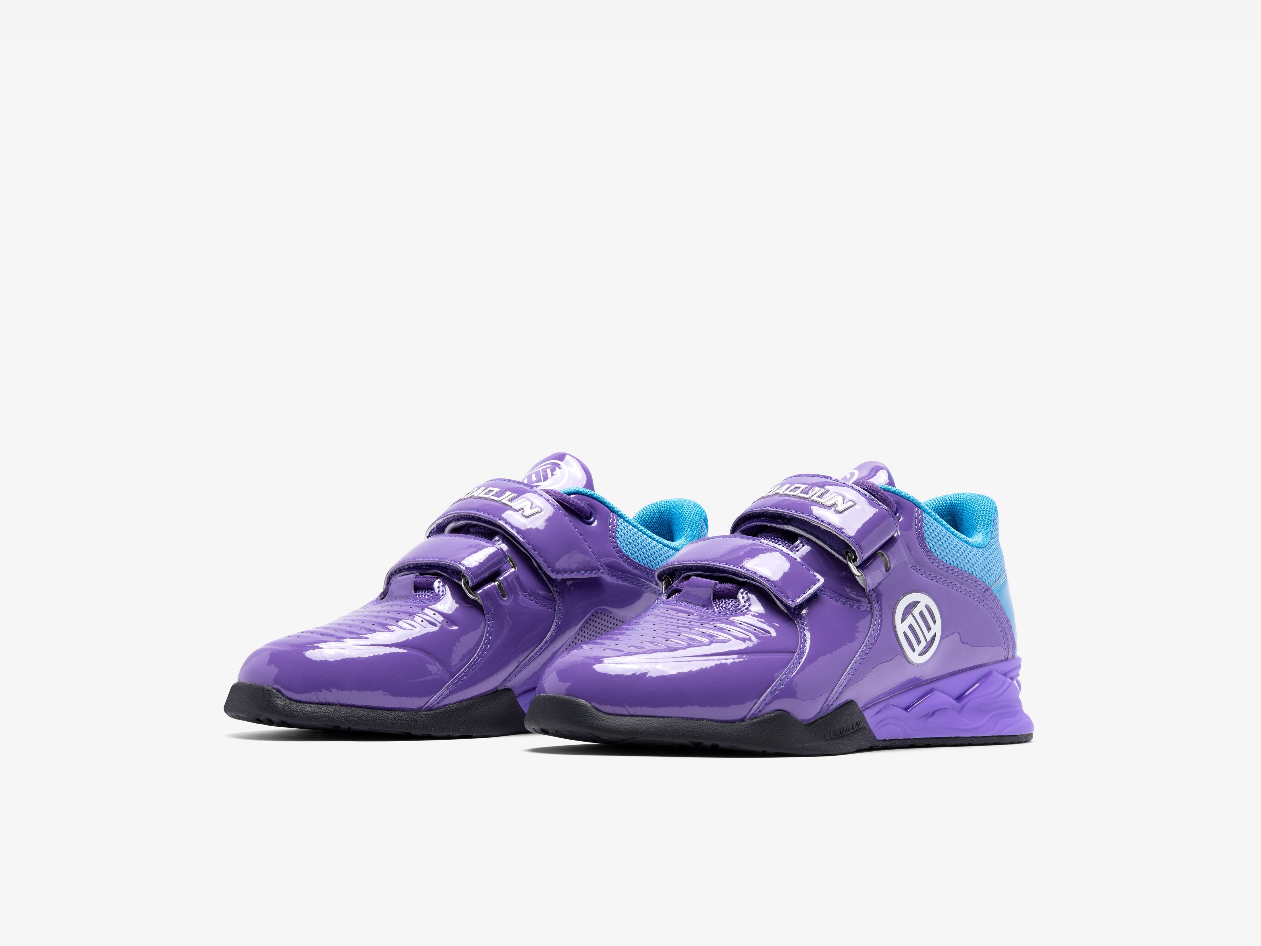 Purple athletic lifting squat shoes with blue accents on a white background