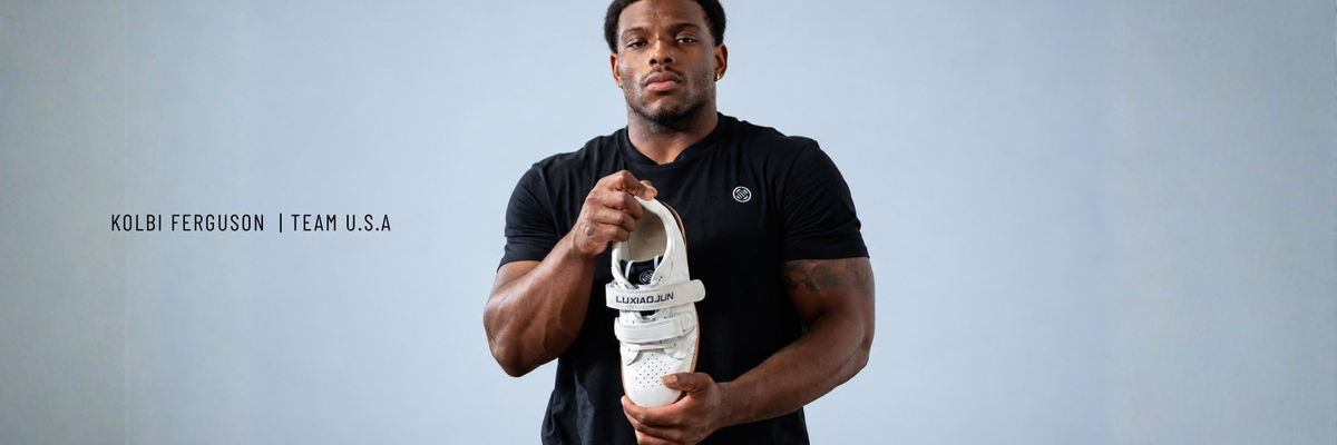 Kolbi Ferguson, Team USA, holding the white Heritage Lifter.