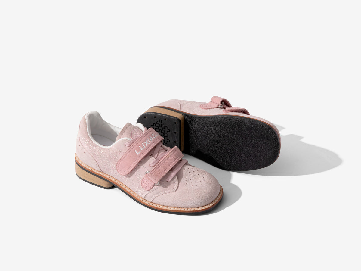 Pink Heritage Lifter pair with one shoe turned over to show the black outsole