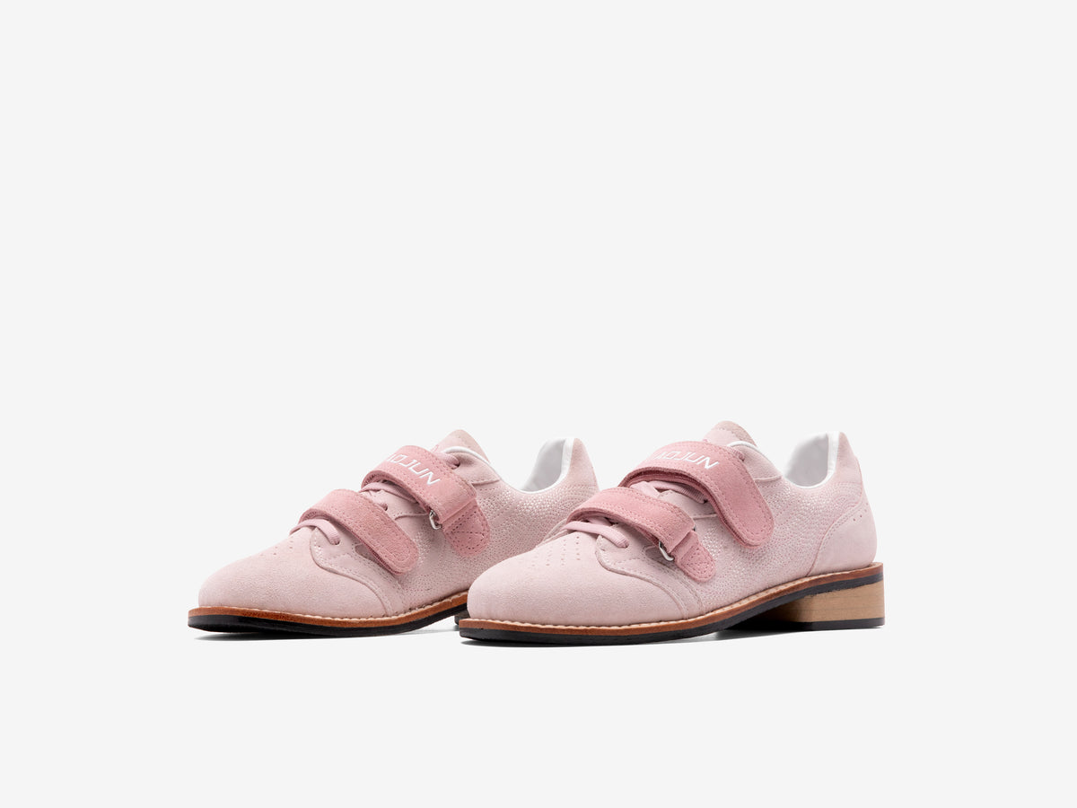 Pair of pink suede LUXIAOJUN Heritage Lifter weightlifting shoes with two pink straps and beechwood heels