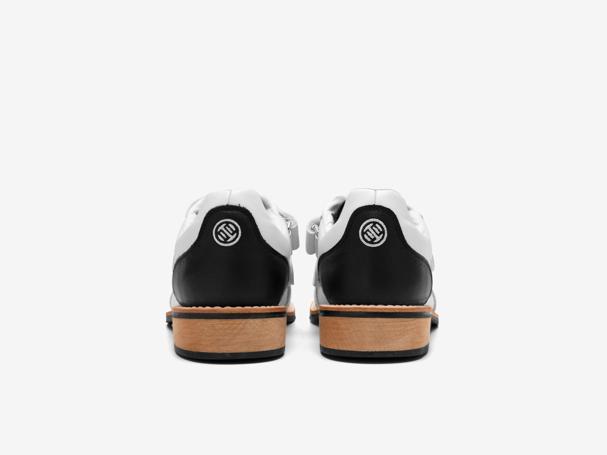 Back view of the white Heritage Lifter pair with the round LUXIAOJUN emblem on each heel